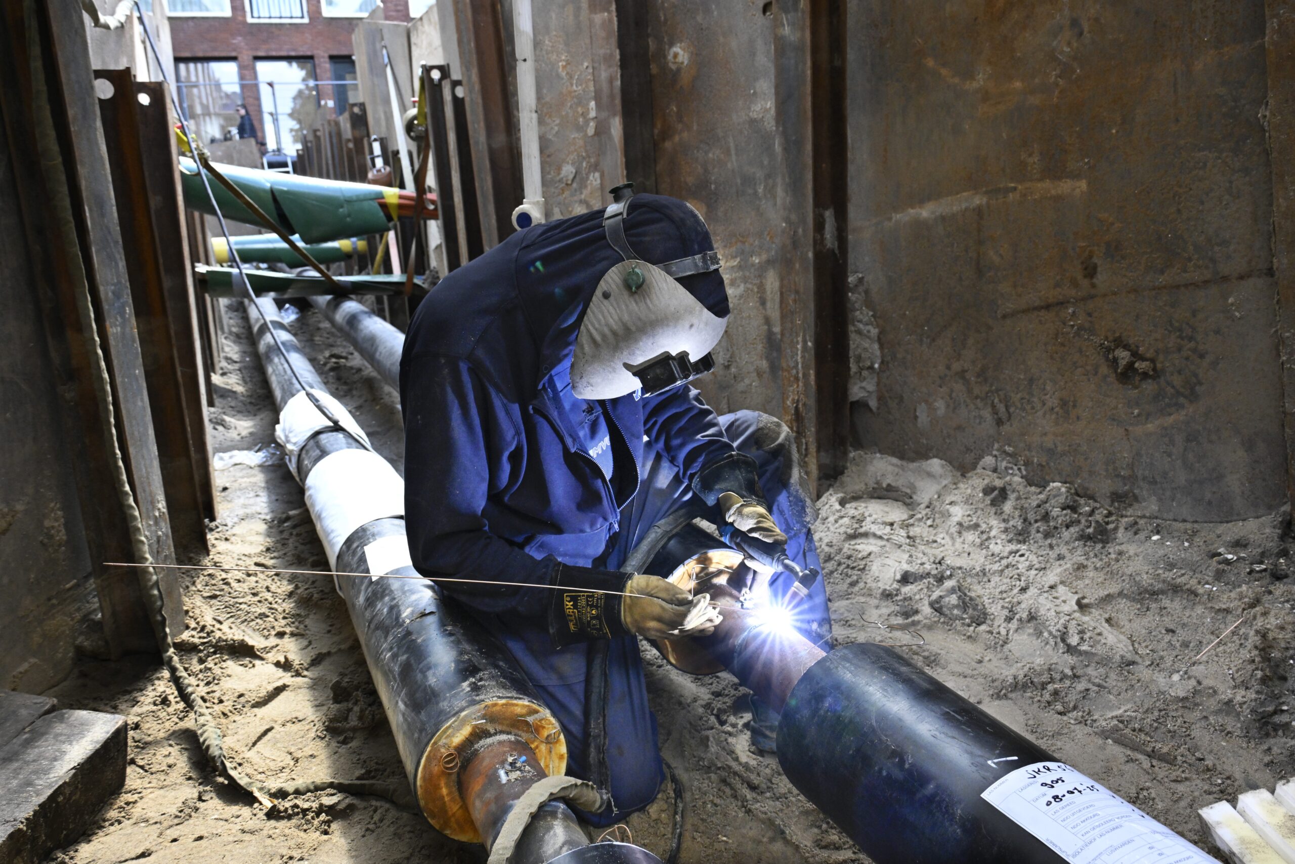 Aanleg van een warmtenet in Rotterdam, een samenwerkingsproject van de gemeente Rotterdam, woningcorporatie Havensteder en energiebedrijf Eneco. Foto: ANP/Hollandse hoogte/Peter Hilz.